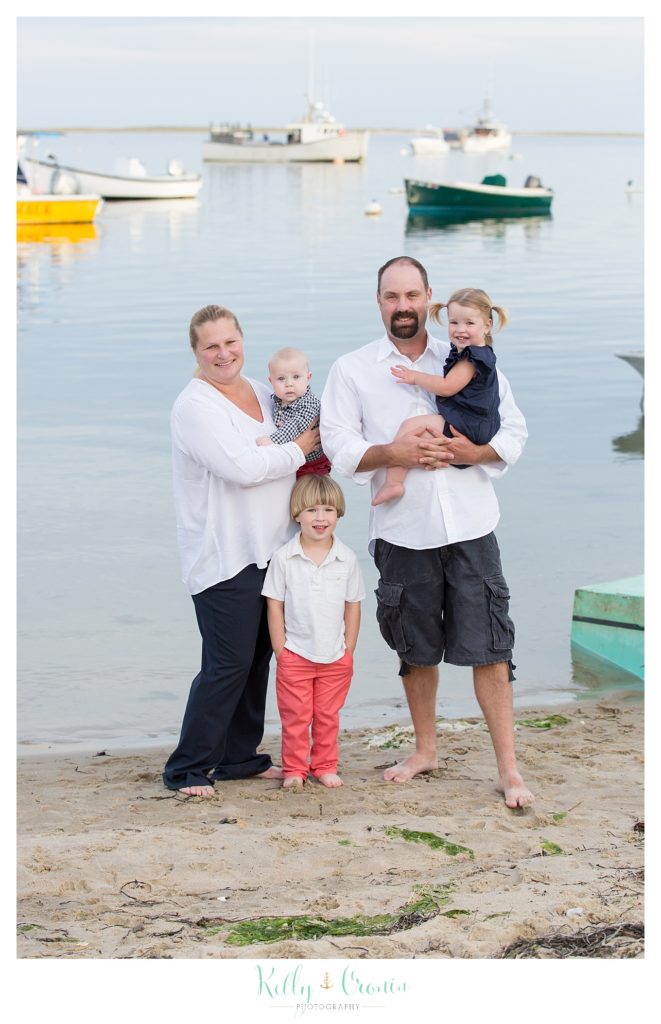 A family poses for photos at Fish Pier in Cape Cod. 