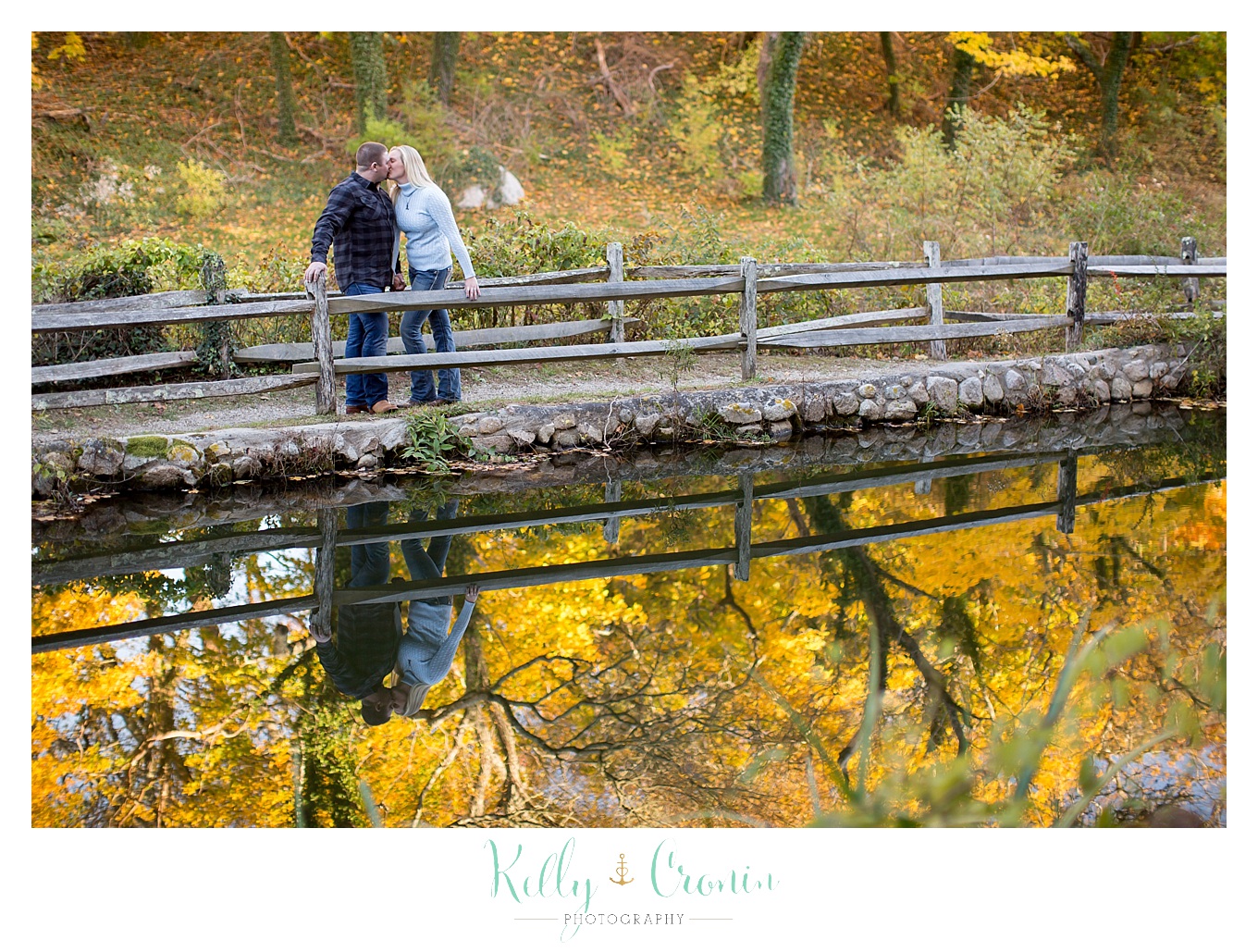 A couple stand among yellow leaves during their Engagement Pictures In Cape Cod.