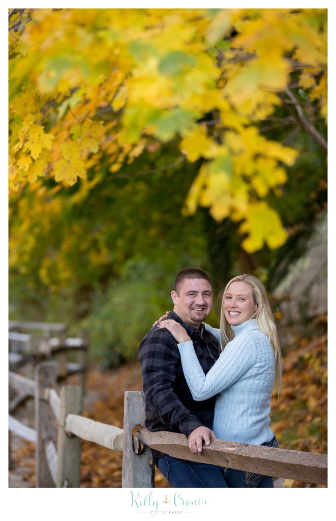 A couple smiles at the camera for their Engagement Pictures In Cape Cod. 