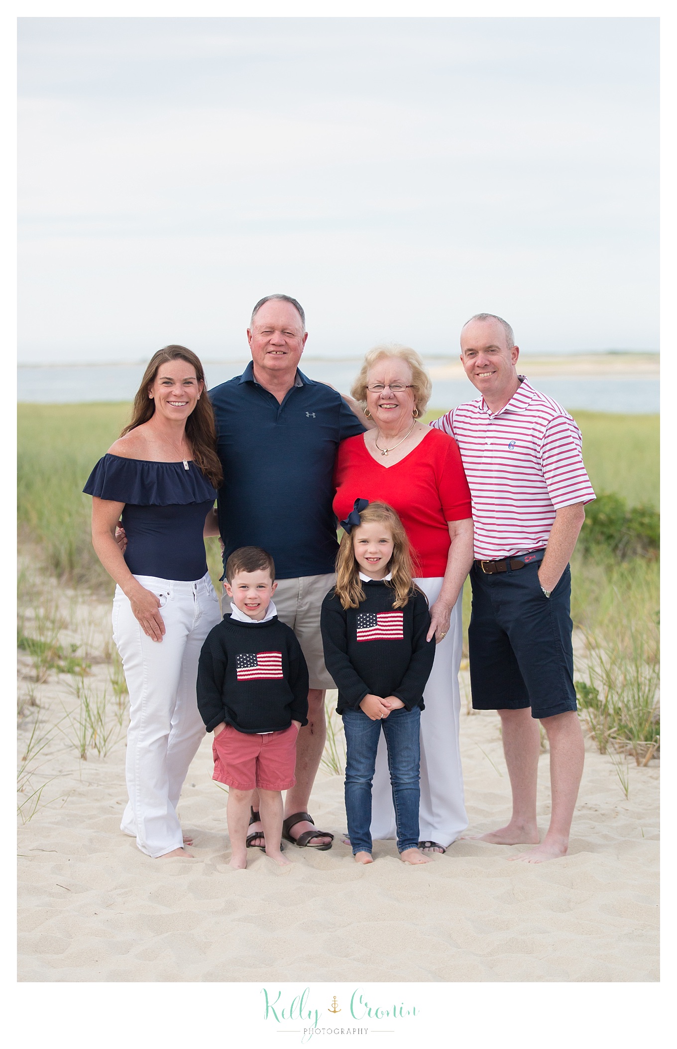 A family poses for their family pictures in Cape Cod.