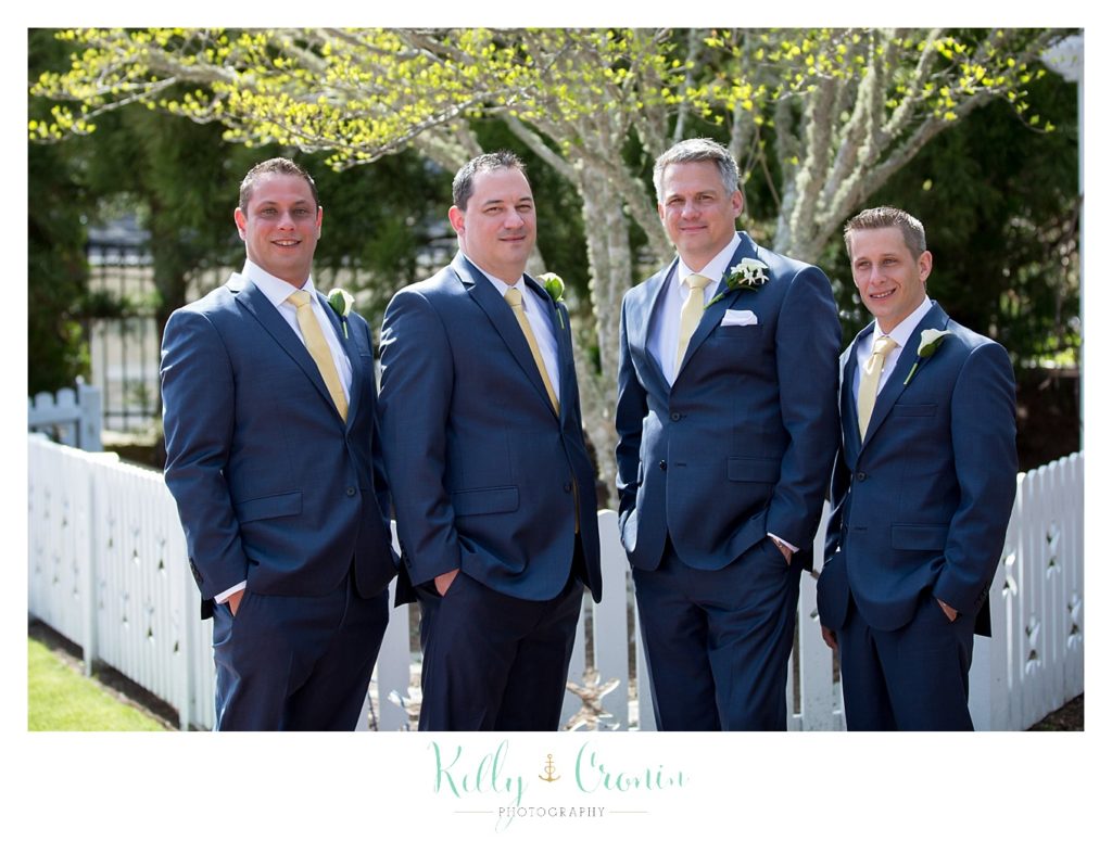 A groom stands with his groomsmen before his Wequassett Inn Wedding. 