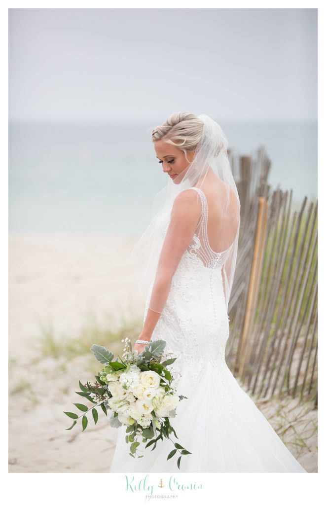 A bride holds her bouquet after her Bourne Farm Wedding. 