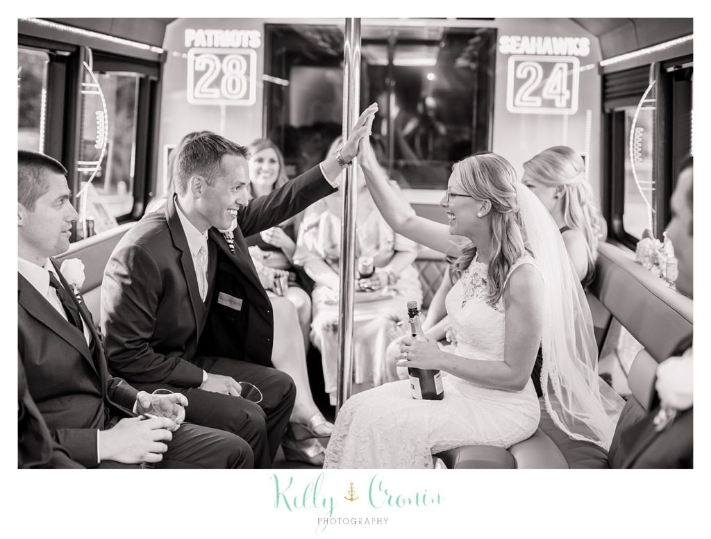 A couple celebrate their wedding inside of the Gronk Party Bus. 