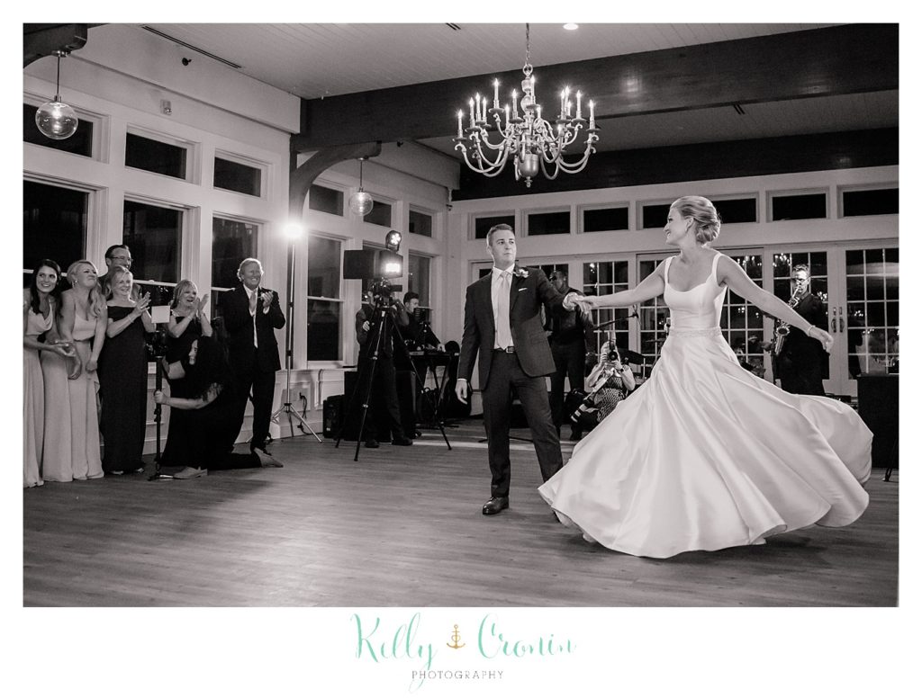A bride and groom share their first dance. 