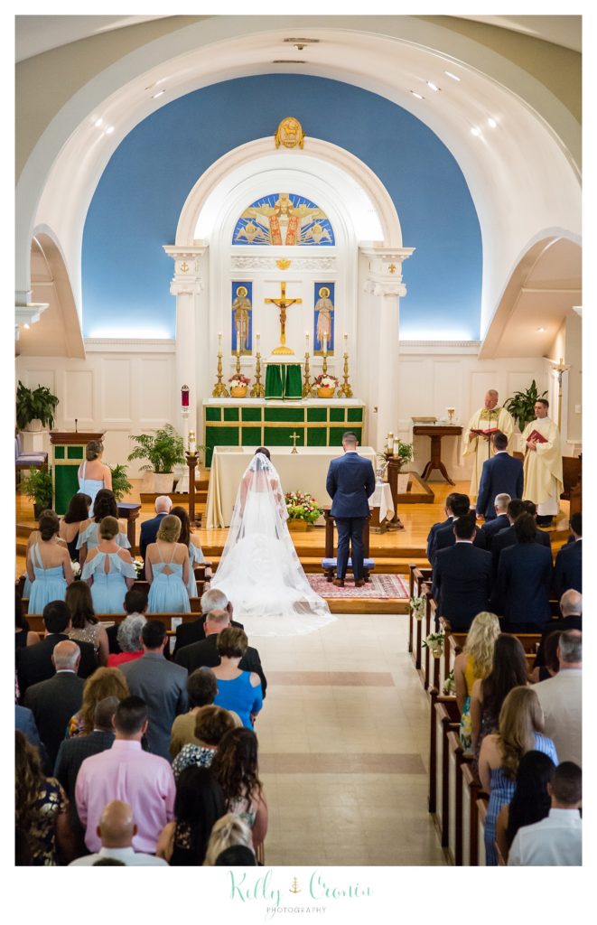 A couple get married in a church. 