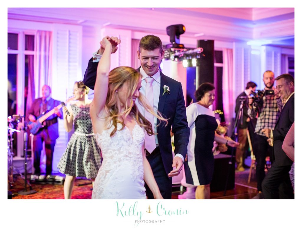 A bride and groom dance at their reception. 